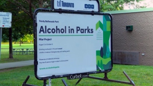 A sign at Trinity Bellwoods Park advising residents that it is part of the Alcohol in Parks pilot program.