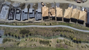 New homes are built in a housing construction development in the west end of Ottawa on Thursday, May 6, 2021. The Canadian Real Estate Association is lowering its forecast for home sales and prices this year due to weakness in Ontario and B.C.THE CANADIAN PRESS/Sean Kilpatrick