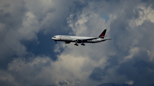 FILE - An Air Canada is seen on approach to land at Vancouver International Airport in Richmond, B.C., on Tuesday, April 11, 2023. THE CANADIAN PRESS/Darryl Dyck 
