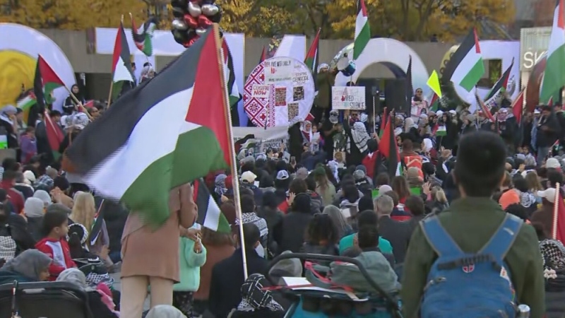 Thousands of pro-Palestinian demonstrators move through downtown Toronto streets