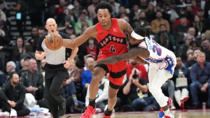 Toronto Raptors' Scottie Barnes drives past Philadelphia 76ers' Patrick Beverley during first half NBA basketball action in Toronto on Saturday, October 28, 2023. THE CANADIAN PRESS/Chris Young