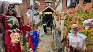 Skeletons decorate a house in the Leslieville neighbourhood of Toronto for Halloween. (CTV News Toronto/Kenneth Enlow)