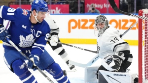 Los Angeles Kings goaltender Cam Talbot looks on as Toronto Maple Leafs' John Tavares goes after a loose puck during second period NHL hockey action in Toronto, on Tuesday, October 31, 2023.THE CANADIAN PRESS/Chris Young