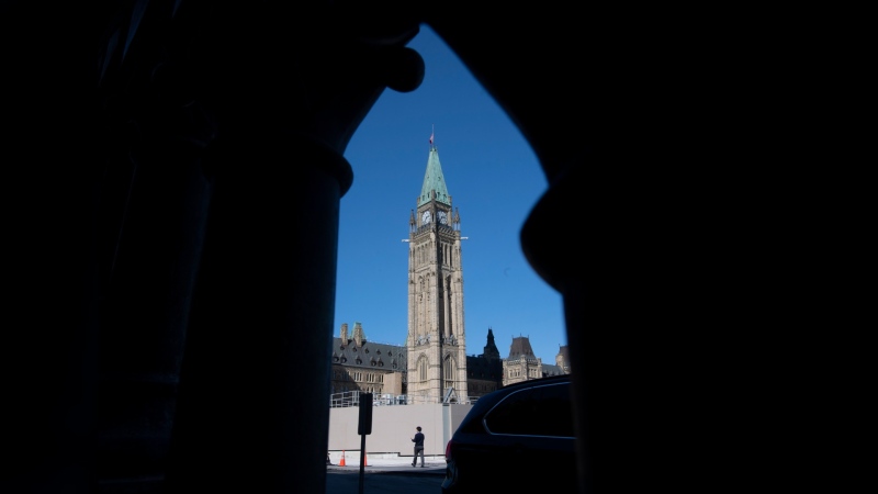 A man walks outside Parliament buildings in Ottawa, Monday Sept. 21, 2020. (Source: THE CANADIAN PRESS/Adrian Wyld)
