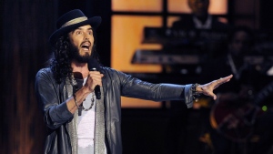 In this Nov. 3, 2012 file photo, comedian Russell Brand performs at "Eddie Murphy: One Night Only," a celebration of Murphy's career, at the Saban Theater in Beverly Hills, Calif. The BBC said Tuesday, Nov. 14, 2023 two more people have come forward to complain about Russell Brand since the broadcaster launched a review into the actor and comedian's behavior. (Photo by Chris Pizzello/Invision/AP, File)