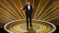 FILE - Host Jimmy Kimmel speaks at the Oscars on March 12, 2023, at the Dolby Theatre in Los Angeles. Kimmel is returning as host of the Academy Awards, the Academy of Motion Pictures Arts and Sciences announced Wednesday. (AP Photo/Chris Pizzello, File)