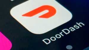 The DoorDash app is shown on a smartphone on Feb. 27, 2020, in New York. (AP Photo, File)