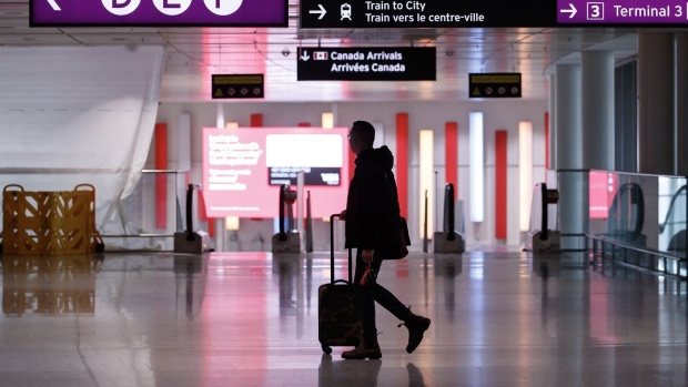 The CEO of online travel agency FlightHub says demand for air travel may be levelling off after soaring to pre-pandemic levels over the summer. Travellers make their way through Pearson International Airport in Toronto Monday, Nov. 14, 2022. THE CANADIAN PRESS/Cole Burston