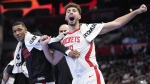 Houston Rockets forward Jabari Smith Jr., left, and center Alperen Sengun celebrate from the bench after they the Rockets scored during the second half of an NBA basketball In-Season Tournament game against the Los Angeles Clippers Friday, Nov. 17, 2023, in Los Angeles. (AP Photo/Mark J. Terrill)
