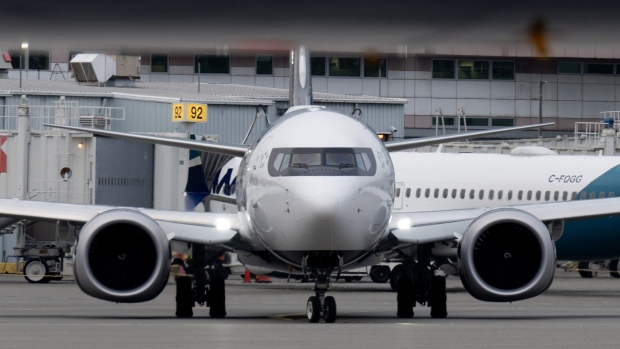 Statistics Canada says airfares have plummeted over the past year, as airlines shore up capacity even while consumers think twice about travel amid a higher cost of living. An Air Canada jet taxis at the airport, in Vancouver, B.C., Wednesday, Nov. 15, 2023. THE CANADIAN PRESS/Adrian Wyld