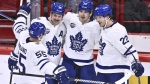 Toronto's Matthew Knies, 2nd right, celebrates scoring with teammates Mark Giordano, left, Auston Matthews, 2nd left, and Jake McCabe during the NHL Global Series Sweden ice hockey match between Toronto Maple Leafs and Minnesota Wild at Avicii Arena in Stockholm, Sweden, Sunday Nov. 19, 2023. THE CANADIAN PRESS/AP-TT, Claudio Bresciani