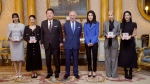 From left, Lisa (Lalisa Manoban), Jennie Kim, South Korea's President Yoon Suk Yeol, King Charles III, first lady of South Korea Kim Keon Hee, Rose (Roseanne Park), and Jisoo Kim pose for a photo following a special investiture ceremony to present the members of the K-Pop band Blackpink with Honorary MBEs, Member of the Order of the British Empire, at Buckingham Palace, in London, Wednesday, Nov. 22, 2023. (Victoria Jones/Pool Photo via AP)