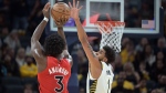 Indiana Pacers forward Obi Toppin (1) jumps to try and block a shot by Toronto Raptors forward O.G. Anunoby (3) during the second half of an NBA basketball game Wednesday, Nov. 22, 2023, in Indianapolis. (AP Photo/Marc Lebryk)