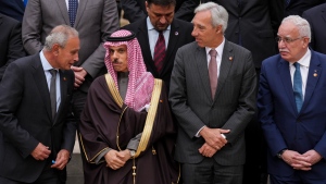From left to right: Secretary General of the Union for the Mediterranean Nasser Kamel, Ministry of Foreign Affairs of Saudi Arabia Prince Faisal bin Farhan Al-Saud, Portugal's Foreign Minister Joao Gomes Cravinho, Palestinian Foreign Minister Riad al-Malki during a family picture with members of European Union member states, Middle East and northern Africa countries at the Union for the Mediterranean event in Barcelona, Spain, Monday, Nov. 27, 2023. (AP Photo/Emilio Morenatti)
