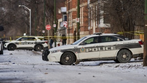 Police secure a crime scene where four people were killed in the 100 block of Langside Street in Winnipeg on Sunday, Nov. 26, 2023. THE CANADIAN PRESS/David Lipnowski