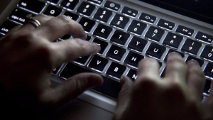 Police in Prince George, B.C., are reporting that a 12-year-old boy died by suicide in October after falling victim to online sextortion. A person uses a keyboard in North Vancouver, B.C., Wednesday, Dec. 19, 2012. THE CANADIAN PRESS/Jonathan Hayward
