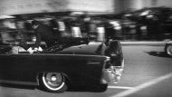 FILE - The limousine carrying mortally wounded President John F. Kennedy races toward the hospital seconds after he was shot, Nov. 22, 1963, in Dallas. The 60th anniversary of President Kennedy's assassination, marked on Wednesday, Nov. 22, 2023, finds his family, and the country, at a moment many would not have imagined in JFK's lifetime. (AP Photo/Justin Newman, File)