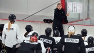 Courtney Kessel, head coach of the Boston-based team of the Professional Women's Hockey League, instructs her players during a team hockey practice ahead of their season, Monday, Nov. 20, 2023, in Wellesley, Mass. Puck drop will follow the New Year's ball drop for the the newly established Professional Women's Hockey League in kicking off its inaugural schedule with Toronto hosting New York on Jan. 1. (AP Photo/Charles Krupa)