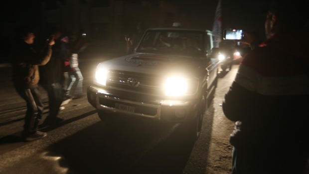 FILE - A Red Cross convoy carrying Israeli hostages heads to Egypt from the Gaza Strip at the Rafah border crossing on Tuesday, Nov. 28, 2023. (AP Photo/Hatem Ali)
