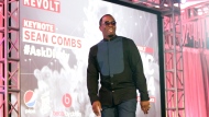 FILE- Sean Combs takes the stage during the REVOLT Music Conference at Fontainebleau Miami Beach on Oct. 17, 2014 in Miami Beach, Florida. The hip-hop artist has temporarily stepped down as chairman of his cable television network Revolt amid multiple sexual abuse allegations against the music mogul. (Photo by Marc Serota/Invision for REVOLT/AP Images)