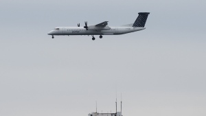 A Porter airplane lands in Toronto on Wednesday, March 18, 2020. Porter Airlines and Air Transat are announcing a joint venture as the two carriers look to expand their range of destinations and tap into each other's markets. THE CANADIAN PRESS/Nathan Denette