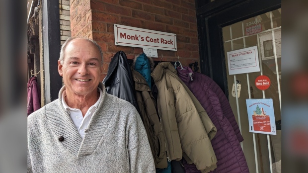 Alex Winch, owner of the Beach Solar Laundromat/Monk’s Fine Fabric Care on Queen Street East, near Beech Avenue, has recently launched a donation-based coat rack for the needy. (Joanna Lavoie/CP24)
