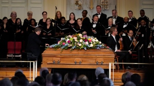 The casket of former first lady Rosalynn Carter is seen during a tribute service at Glenn Memorial Church at Emory University on Tuesday, Nov. 28, 2023, in Atlanta. (AP Photo/Brynn Anderson, Pool)