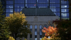 The Bank of Canada is framed by fall-coloured leaves in Ottawa on Monday, Oct. 23, 2023. The Bank of Canada’s public consultations on the creation of a digital Canadian dollar reveal most respondents are opposed to it. THE CANADIAN PRESS/Sean Kilpatrick