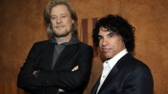 FILE - Daryl Hall, left, and John Oates, recipients of BMI Icons awards, pose together before the 56th annual BMI Pop Awards in Beverly Hills, Calif., on May 20, 2008. Hall has sued his longtime music partner John Oates, arguing that his plan to sell off his share of a joint venture would violate a business agreement the duo had.(AP Photo/Chris Pizzello, File)