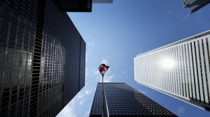 Statistics Canada is set to release its gross domestic product reading for the third quarter this morning. The Bay Street Financial District is shown with the Canadian flag in Toronto on Friday, August 5, 2022. CANADIAN PRESS/Nathan Denette
