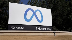 FILE - Facebook's Meta logo sign is seen at the company headquarters in Menlo Park, Calif., on, Oct. 28, 2021. Officials at Meta say they have found and disabled a network of thousands of fake Facebook accounts linked to China that were used to spread partisan content in the U.S. The accounts disclosed on Nov. 30, 2023, were designed to look like they were run by everyday Americans. (AP Photo/Tony Avelar, File)