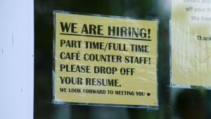 A sign for help wanted is pictured in a business window in Ottawa on Tuesday, July 12, 2022. THE CANADIAN PRESS/Sean Kilpatrick