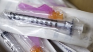 The Public Health Agency of Canada said Friday that the flu season is officially underway in this country. Needles and syringes used to administer the flu shot are pictured on Monday, October 5, 2020. THE CANADIAN PRESS/Tara Walton