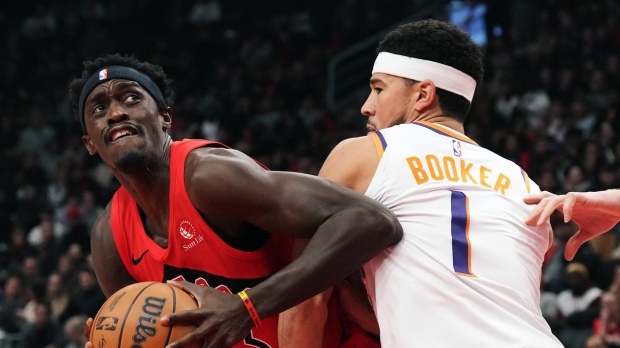 A weekend off gave Toronto Raptors' Pascal Siakam time to rest, recharge, and reflect on the first quarter of the NBA season. Siakam (43) tries to get around Phoenix Suns' Devin Booker (1) during first half NBA basketball action in Toronto, Wednesday, Nov. 29, 2023. THE CANADIAN PRESS/Chris Young