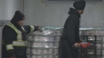 Workers at Food Banks Mississauga unload three metric tonnes of donated yogurt on Dec. 5. 