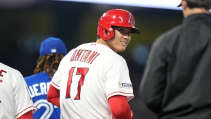 Los Angeles Angels designated hitter Shohei Ohtani (17) looks over his shoulder from first base during the fifth inning of a baseball game against the Toronto Blue Jays in Anaheim, Calif., Saturday, April 8, 2023. (AP Photo/Ashley Landis)