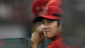 Los Angeles Angels' Shohei Ohtani sits in the dugout during the tenth inning of a baseball game against the Detroit Tigers in Anaheim, Calif., Saturday, Sept. 16, 2023. THE CANADIAN PRESS/AP-Ashley Landis
