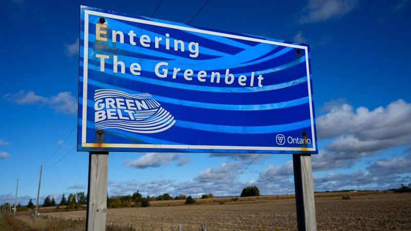 An Ontario Greenbelt sign is shown as it's surrounded by farmland near Caledon, Ont., on Thursday, October 12, 2023. The Greenbelt is a protected area of green space, farmland, forests, wetlands, and watersheds, located in Southern Ontario, Canada. THE CANADIAN PRESS/Nathan Denette 