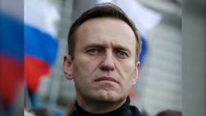 Russian opposition activist Alexei Navalny takes part in a march in memory of opposition leader Boris Nemtsov in Moscow, Russia on Feb. 29, 2020. Associates of imprisoned Russian opposition leader Alexei Navalny say he has been located at a prison colony above the Arctic Circle nearly three weeks after contact with him was lost. Navalny, the most prominent foe of Russian President Vladimir Putin, is serving a 19-year sentence on charges of extremism. (AP Photo/Pavel Golovkin, File)