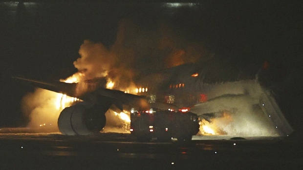 Japan plane bursts into flames