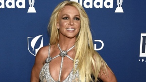  In this April 12, 2018 file photo, Britney Spears arrives at the 29th annual GLAAD Media Awards in Beverly Hills, Calif. Spears is shooting down rumors of a new album, vowing to “never return to the music industry.” At the same time, Spears noted in an Instagram post Wednesday, Jan. 3, 2024, she's still writing music — just for other people. (Photo by Chris Pizzello/Invision/AP, File)