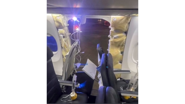 This photo provided by an unnamed source shows the damaged part of an Alaska Airlines Boeing 737 Max 9, Flight 1282, which was forced to return to Portland International Airport on Friday, Jan. 5, 2024. (The Oregonian via AP)