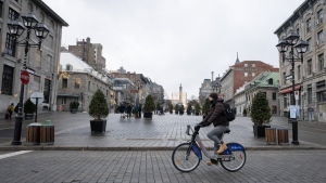 A new study suggests human-caused climate change is behind a sharp drop in spring snowpack across large parts of the Northern Hemisphere, including a swath of Ontario and Quebec. People walk on the snowless streets of Place Jacques Cartier in Old Montreal, Wednesday, Jan. 3, 2024. THE CANADIAN PRESS/Ryan Remiorz