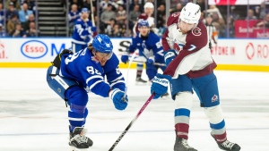 Colorado Avalanche defenceman Devon Toews (7) clears the puck from Toronto Maple Leafs right wing William Nylander (88) during second period NHL hockey action in Toronto, Saturday, Jan. 13, 2024. THE CANADIAN PRESS/Chris Young