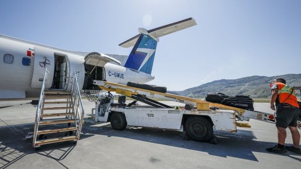 The union representing pilots with WestJet's regional subsidiary have started the clock on potential job action — though any moves on that front are still at least three months off. A WestJet Encore Bombardier Q400 twin-engined turboprop aircraft is prepared for a flight in Kamloops, B.C., Saturday, June 3, 2023.THE CANADIAN PRESS/Jeff McIntosh
