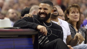 Performer Drake has a laugh courtside during first half NBA basketball action between the Toronto Raptors and the Milwaukee Bucks, in Toronto, Tuesday, Feb. 25, 2020. UFC president Dana White reposted a betting slip from Drake's verified Instagram account showing the Toronto rapper has wagered $700,000 on Strickland to beat South African challenger Dricus (Stillknocks) Du Plessis. The estimated payout is $1.379 million. THE CANADIAN PRESS/Nathan Denette
