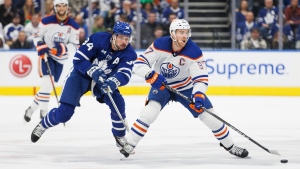 Toronto Maple Leafs centre Auston Matthews (34) chases Edmonton Oilers centre Connor McDavid (97) during first period NHL hockey action in Toronto on Saturday, Mar. 11, 2023. THE CANADIAN PRESS/Cole Burston 