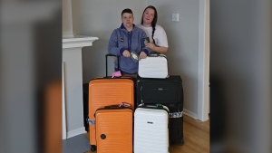 Meagan Watson, left, and her wife Mindy are seen in a undated handout photo with their luggage. The Watsons were among thousands of WestJet customers whose trips were cancelled amid an extreme cold snap in Alberta earlier this month. Many say the airline refused to book them within two days despite a regulatory obligation to do so in most cases. THE CANADIAN PRESS/HO-Watson family