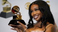 SZA, winner of the award for best pop duo/group performance for "Kiss Me More," poses in the press room at the 64th Annual Grammy Awards on April 3, 2022, in Las Vegas. SZA is nominated for nine Grammy Awards. The 66th annual Grammy Awards will take place Sunday, Feb. 4, at the Crypto.com Arena in Los Angeles. (AP Photo/John Locher, File)