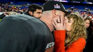 Taylor Swift kisses Kansas City Chiefs tight end Travis Kelce after an AFC Championship NFL football game against the Baltimore Ravens, Sunday, Jan. 28, 2024, in Baltimore. The Kansas City Chiefs won 17-10. (AP Photo/Julio Cortez) 